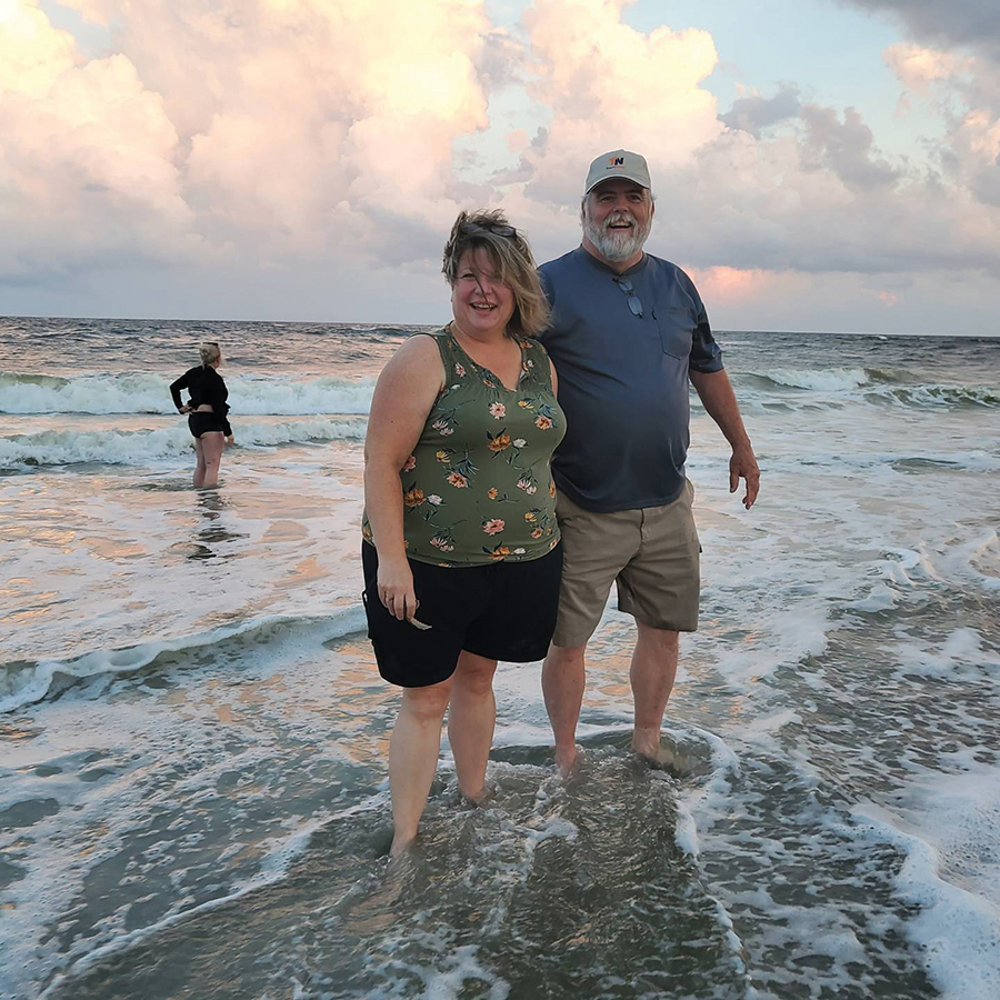 Peggy Scott, publisher, Leader Publications, Festus, Missouri, and husband, Rob Scott, enjoy a walk along the beach Friday night of convention before a storm rolled in and attendees scattered to the buses, restaurants and shops.