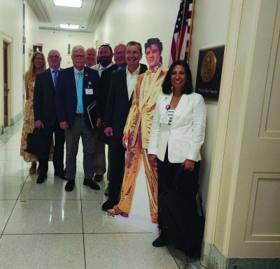 While in Washington, D.C., the NNA public policy team took a photo opp with a pop-up of Elvis Presley. Left to right: NNA Executive Director Lynne Lance; Public Policy Committee Chair Brett Wesner, publisher, Wesner Publications, Cordell, Oklahoma; NNA Postal Chair Matt Paxton, publisher, The News-Gazette, Lexington, Virginia; Brad Hill, CEO, Interlink of Berrien Springs, Michigan; John Denny Montgomery, publisher, Purcell (Oklahoma) Register; NNA Past President John Galer, publisher, The Journal-News, Hillsboro, Illinois; Brad Thompson, president, Detroit Legal News Publishing LLC; and NNA Chair Martha Diaz Aszkenazy, publisher, The San Fernando Valley (California) Sun/El Sol Newspapers.
(Lisa McGraw, Pub Aux) While in Washington, D.C., the NNA public policy team took a photo opp with a pop-up of Elvis Presley. Left to right: NNA Executive Director Lynne Lance; Public Policy Committee Chair Brett Wesner, publisher, Wesner Publications, Cordell, Oklahoma; NNA Postal Chair Matt Paxton, publisher, The News-Gazette, Lexington, Virginia; Brad Hill, CEO, Interlink of Berrien Springs, Michigan; John Denny Montgomery, publisher, Purcell (Oklahoma) Register; NNA Past President John Galer, publisher, The Journal-News, Hillsboro, Illinois; Brad Thompson, president, Detroit Legal News Publishing LLC; and NNA Chair Martha Diaz Aszkenazy, publisher, The San Fernando Valley (California) Sun/El Sol Newspapers.
(Lisa McGraw, Pub Aux)