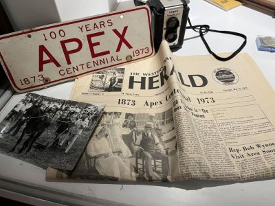 The Western Wake Herald (aka Apex Herald) has figured prominently in all the major events of the town of Apex, North Carolina. This display contains artifacts from the town’s centennial 50 years ago. The Western Wake Herald (aka Apex Herald) has figured prominently in all the major events of the town of Apex, North Carolina. This display contains artifacts from the town’s centennial 50 years ago.