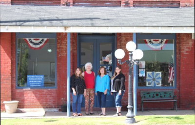 Pictured L to R outside the Hardin County Independent office in Elizabethtown, Illinois: Jennifer Rash Lane, owner, editor, publisher; Susie Hurford Williams, volunteer; Julie Hurford Farley, retired owner, editor and publisher; Heather Rash, ad designer/reporter.  (Hardin County Independent)