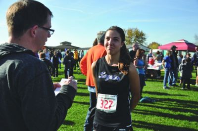 Sequim Gazette Editor Michael Dashiell interviews a Sequim High School cross country runner at the state 2A championships in Pasco in 2015. (Photo courtesy of Michael Dashiell) Sequim Gazette Editor Michael Dashiell interviews a Sequim High School cross country runner at the state 2A championships in Pasco in 2015. (Photo courtesy of Michael Dashiell)
