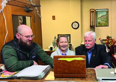 From left, Jesse Mullen, Cynthia and Steve Haynes, announce the sale of the newspapers with their staff over a video conference in Oberlin, Kansas.