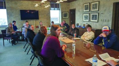 Interns and staff at The Press Times of Green Bay, Wisconsin, gather around a conference table to learn from George Stanley, the retired editor of the Milwaukee Journal Sentinel, who has joined the newspaper s parent company, Multi Media Channels, as an adviser for the newspaper group s internship program. (The Press Times, Green Bay, Wisconsin)