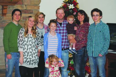 The Glasford Gazette: A family affair. Jessica Westerman publishes the newspaper from her home office. Even though they don’t work for the paper, her family is very much involved, especially her junior editors. Left to right: son Jake, his fiancé, Aubrey; daughters Megan, Izzy, Amelia (junior editor); husband, Ben; son Calvin (junior editor), Jessica and son Justin.