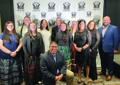 Cherokee Phoenix staff at the newspaper’s Dec. 10 Seven Feathers Awards Gala, honoring Cherokees who work to make the world a better place in the categories of business, community, education, health and service, and work that advances the tribe’s culture and language. Kneeling: Will Chavez. Front row: Terris Howard, Samantha Cochran, Lindsey Bark and Carmellita Vann, Back row: D. Sean Rowley, Dena Tucker, Chad Hunter, Stacie Boston, Joy Rollice and Tyler Thomas. Not pictured: 
Mark Dreadfulwater.