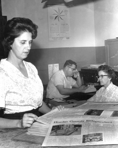 The late Betty, pictured left, and Noel Hurford, pictured center (former owner and editor respectively), work at the Hardin County Independent in Elizabethtown with office clerk, Gladys McDowell  — year 1966. Retired owner, editor and publisher Julie Hurford Farley was 12 then. Julie and her sister, Heather, grew up in the newspaper business; to this day, they can smell the ink from the old press on paper day and can see the line of people out on the sidewalk waiting for their copy “hot off the press.” Times sure have changed with the invention of computers. Ten years after this picture was taken, Julie began working for her dad at the Independent. She retired last year, with daughter Jennifer Rash Lane now at the helm.