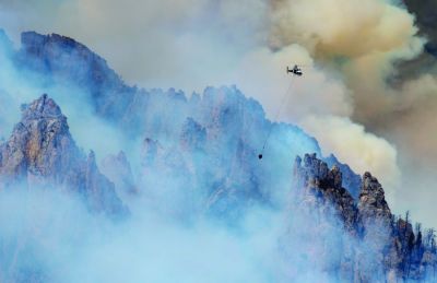 A wildfire north of Clark, Wyoming in the Beartooth Mountain Range ignited Monday, June 14th, rapidly growing from about 40 acres in the morning to roughly 230 acres by the late afternoon. When it was first reported Sunday, the Robertson Draw Fire was burning mostly in sagebrush and grass. However, the fire moved into the timber in the Shoshone and Custer Gallatin National Forests Monday as Clark residents watched flames towering over mature trees and spreading quickly. (June 15, 2021) (Mark Davis | Powell (Wyoming) Tribune)