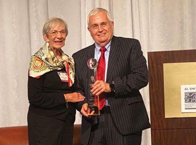 Martha Helen Smith, widow of Al Smith, shares the stage with Al Cross as he is awarded with the Al Smith Polaris Award. (Pat Host) Martha Helen Smith, widow of Al Smith, shares the stage with Al Cross as he is awarded with the Al Smith Polaris Award. (Pat Host)