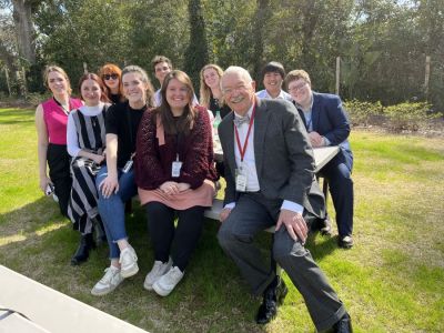 Jay Bender (front right) sits with a group of students from the University of South Carolina School of Journalism and Mass Communication whom had traveled to Walterboro, South Carolina, to cover the sights and sounds around town and gather reactions to the Murdaugh trial. Pictured from left: (front row) Abby Foncannon, Margaret Walker, Taylor Kaye Beltz, Jay Bender, (back row) Caroline Barry, Eileen Waddell, Wade Rainey, Grace Brown, Raymond Escoto and G.E. Hinson.