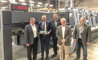 Image includes left to right: Paul Dowden, vice president of global operations, Jostens; Rob Robinson, account manager, Heidelberg; Wayne Davidson (rear), yearbook manufacturing manager, Jostens; Jim Self (front), senior director of grad products, Jostens; Jeff Phelps, press process engineer, Jostens