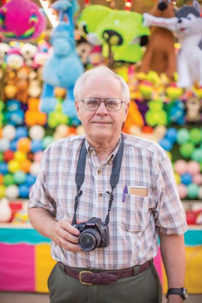 A pre-pandemic photo of Bill Blauvelt shooting photos at a local carnival in Superior.