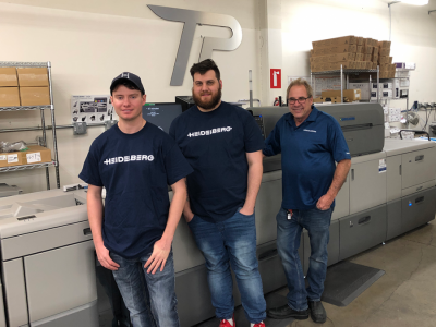 Jonathon Long, prepress/design at Time Printing Solutions Provider; Kyle Friesner, digital operator at Time Printing Solutions Prover; and Andy Poole, president of Time Printing Solutions Provide, in front of the Versafire EP Jonathon Long, prepress/design at Time Printing Solutions Provider; Kyle Friesner, digital operator at Time Printing Solutions Prover; and Andy Poole, president of Time Printing Solutions Provide, in front of the Versafire EP